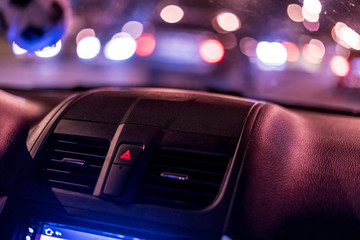 night city car cabin interior with the defocused street traffic lights