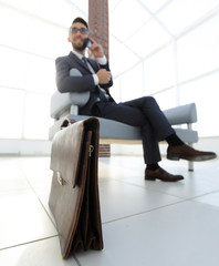 Fototapeta premium businessman holding his briefcase in office
