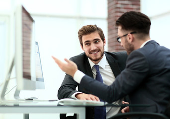two leaders having a business discussion in the office.