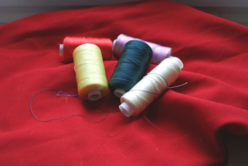  silk threads on a red background