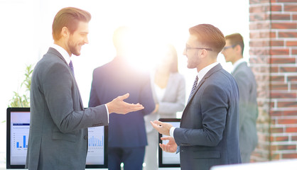 Group of business partners interacting during break