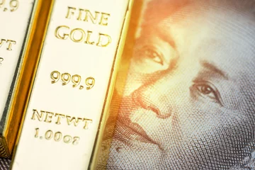 Foto op Aluminium China national gold reserve concept, shiny gold bar bullion ingot on Chinese yuan banknote money with shiny golden flare light, country financial asset or safe haven investment in stock crisis © Nuthawut
