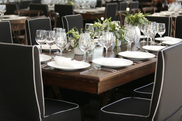 elegant Table decoration with wine glasses, glasses, forks, ornaments, ready to serve in event, wedding, celebration, xv years, baptism