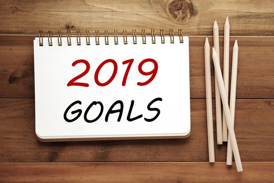 2019 goals on notebook paper background, banner sign, 2019 new year business strategy annual plan, success in business concept
