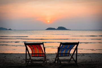Sun loungers on the sea beach at evening.
