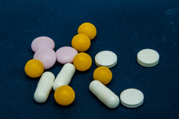 tablets are scattered on the table, dosage for the patient