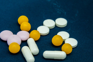 tablets are scattered on the table, dosage for the patient