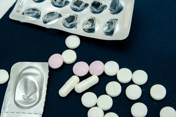 tablets are scattered on the table, dosage for the patient