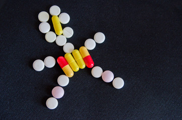 tablets are scattered on the table, dosage for the patient