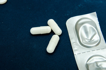 tablets are scattered on the table, dosage for the patient