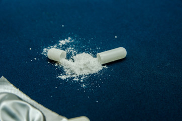tablets are scattered on the table, dosage for the patient