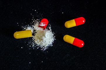 tablets are scattered on the table, dosage for the patient