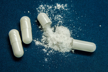 tablets are scattered on the table, dosage for the patient