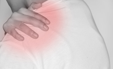 Man suffering from shoulder pain on white background  ,  Healthcare and medical concept..