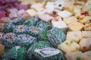 Multi-colored rolls oriental sweetness close-up, soft selective focus with shallow depth of field