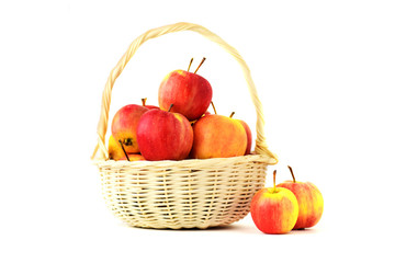 red apples in rattan basket on white background isolated with clipping path