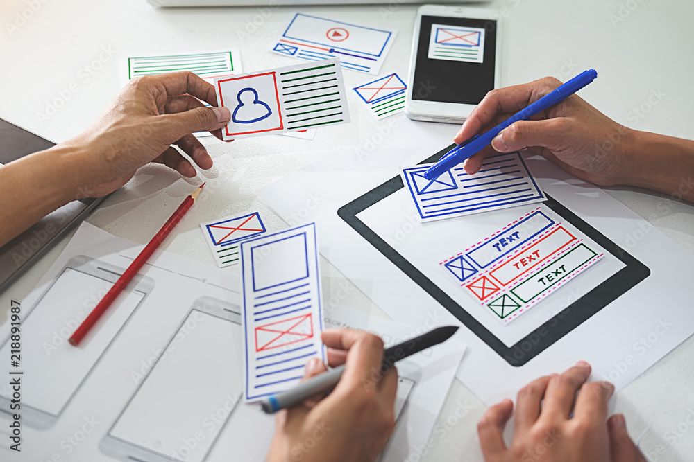 Wall mural creative web designer planning application and developing template layout, framework for mobile phon