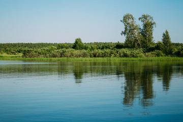 Fototapeta na wymiar Clear lake with reflection in water