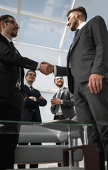 bottom view.handshake business people in the office.