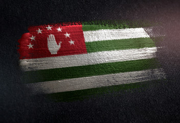 Abkhazia Flag Made of Metallic Brush Paint on Grunge Dark Wall