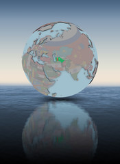 Turkmenistan on globe above water surface
