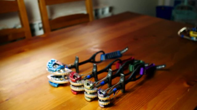 Various climbing cams on a wood table