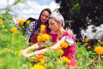 Mother and daughter gardening together