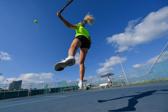 Girl playing tennis on a court