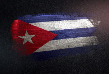 Cuba Flag Made of Metallic Brush Paint on Grunge Dark Wall © natanaelginting