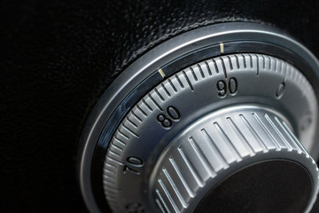 Close-up of a combination dial on a safe.
