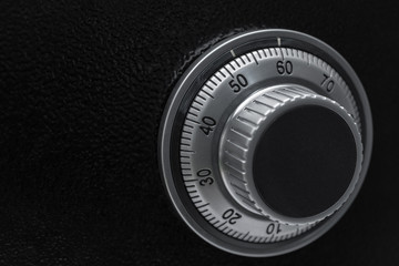 Close-up of a combination dial on a safe.