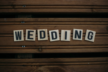 Wedding. Text on a wooden background