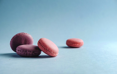 pink macarones on blue background