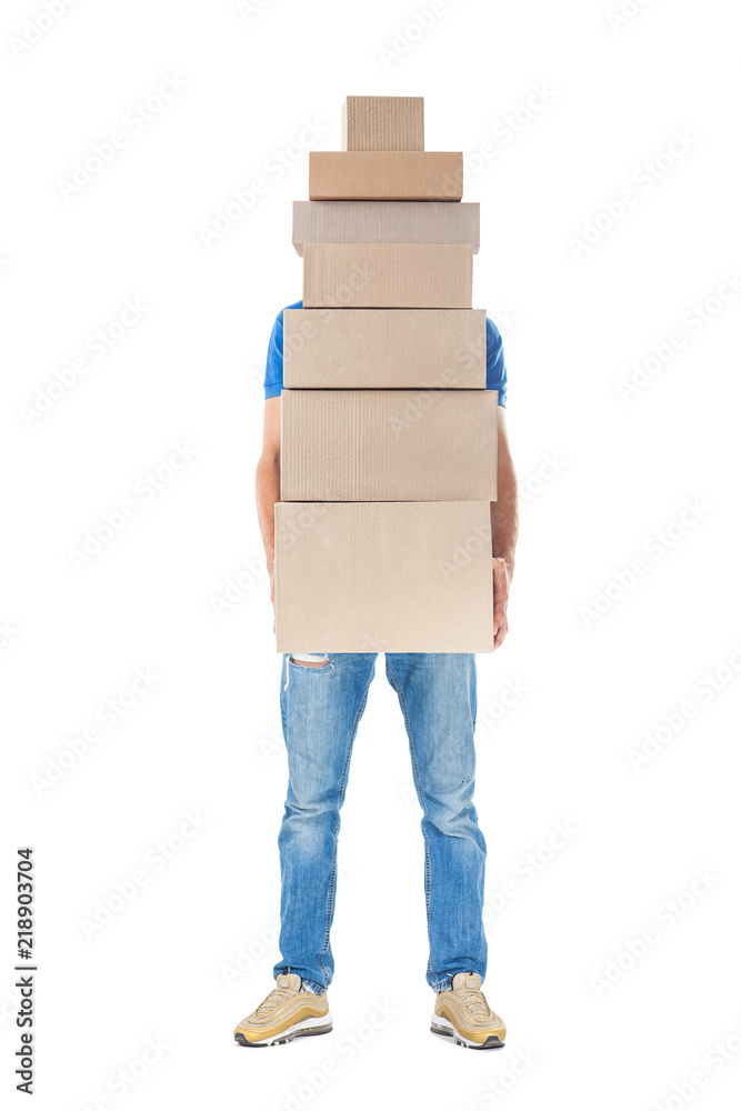 Wall mural Delivery man hiding behind large stack of cardboard boxes