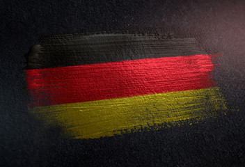 Germany Flag Made of Metallic Brush Paint on Grunge Dark Wall