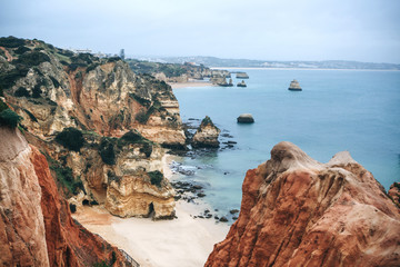 A view of the beautiful beach and rocks and the Atlantic Ocean off the coast of Portugal next to the city called Lagos.