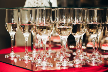 Luxury champagne glasses on table in restaurant close-up, elegant business reception party, corporate dinner party concept, expensive tableware