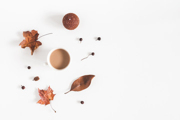 Autumn composition. Cup of coffee, autumn plants on white background. Flat lay, top view, copy space