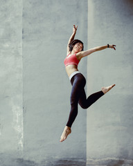 Fototapeta na wymiar Happy young woman jumping 
