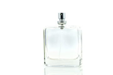 Perfume bottle , spraying perfume on white background, closeup