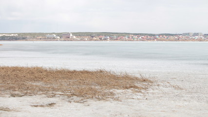 the city on the background of frozen river