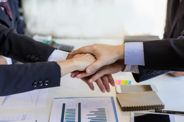 Business people together to work as a team to ensure the success of the business. Teamwork...