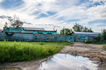 Old, destroyed, abandoned houses and buildings, broken Windows and doors