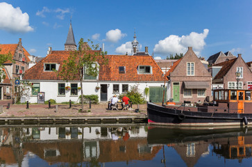Boat and old houses at the quay in Edam, Netherlands