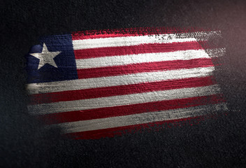 Liberia Flag Made of Metallic Brush Paint on Grunge Dark Wall