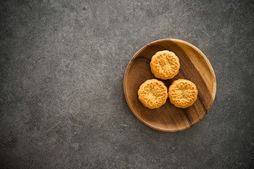 Mid-Autumn Festival Mooncakes with copy space on low light background
