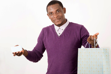 man holding shopping bags and a map in studio