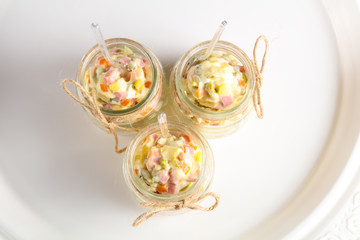 Russian salad in the glass can