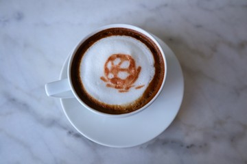 football coffee latte art on white cup