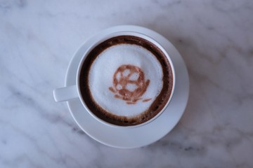 football coffee latte art on white cup